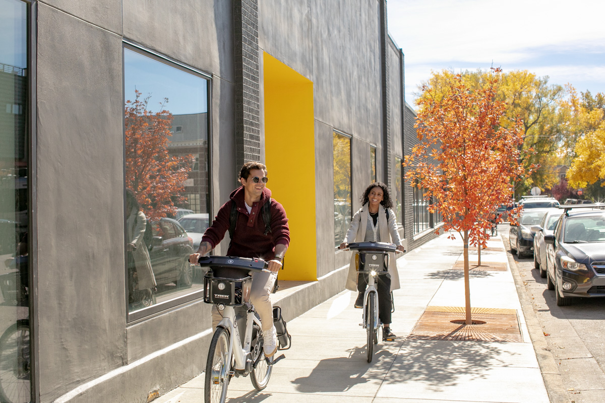 Commuting on ebikes on Pearl Street  in Boulder, Colorado and photography by Julia Vandenoever.