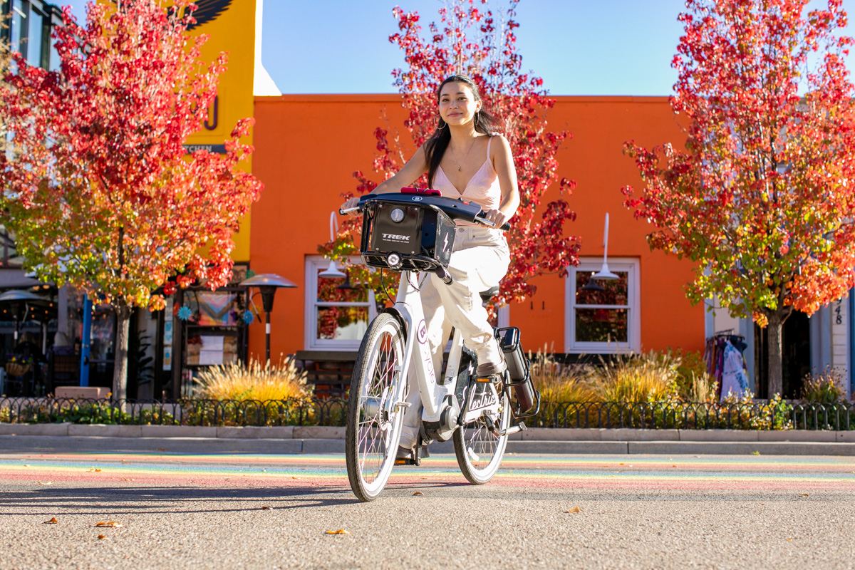 Commuting on ebikes on Pearl Street  in Boulder, Colorado and photography by Julia Vandenoever.